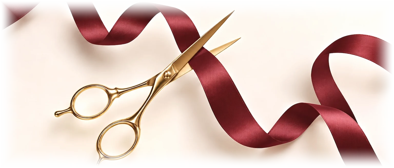 Deep burgundy satin ribbon and polished gold hairdressing scissors
